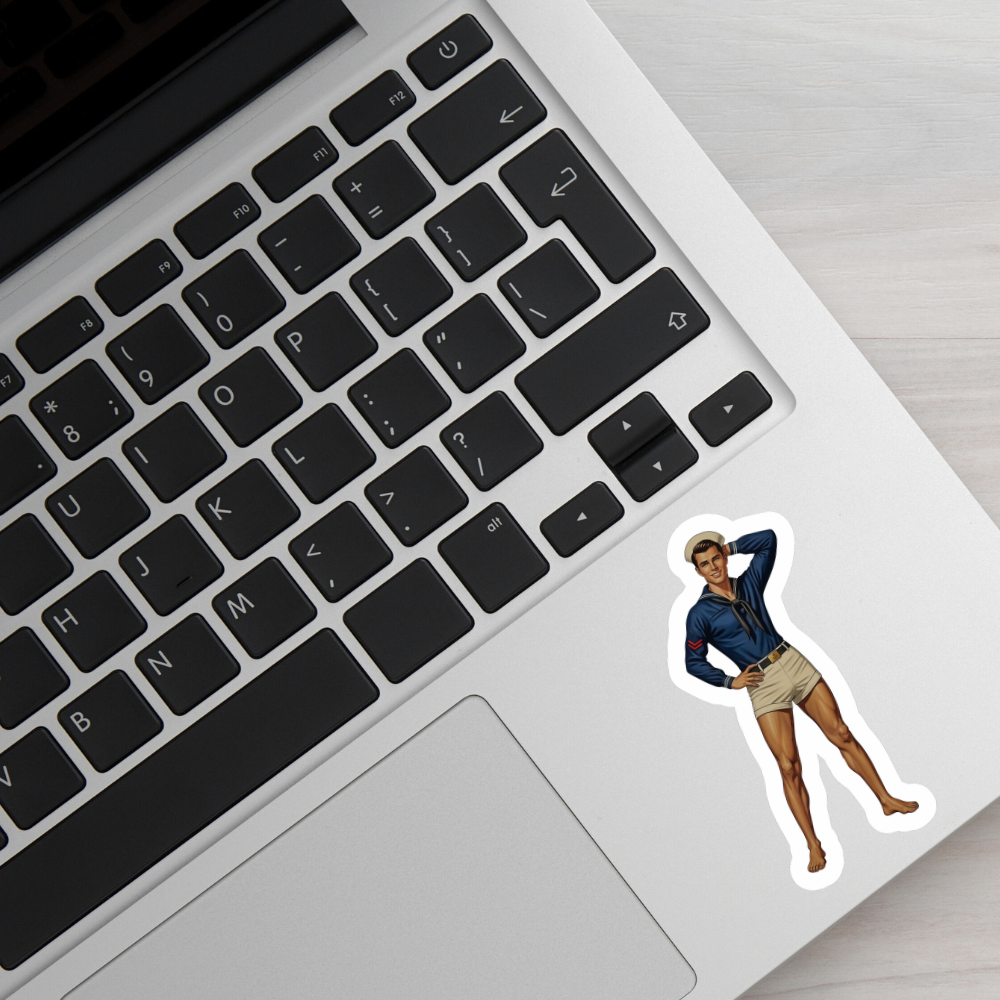 Laptop with a sticker of a person on the palm rest area
